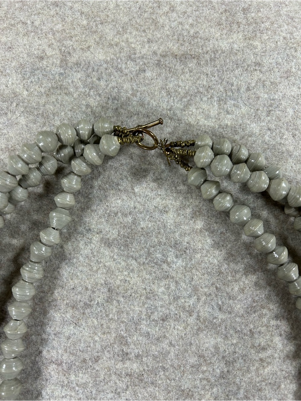 Akola Triple-Strand Gray Beaded Necklace with Bronze Cross Pendant - Picture 3 of 4
